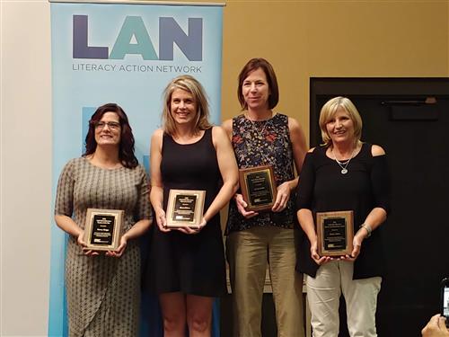Pat adams stands next to fellow award recipients 